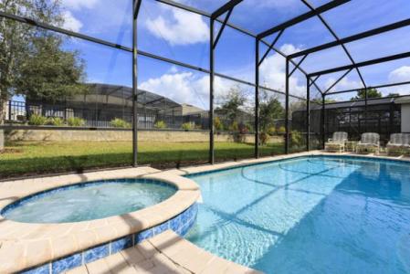 mesh cage screening private swimming pool behind villa